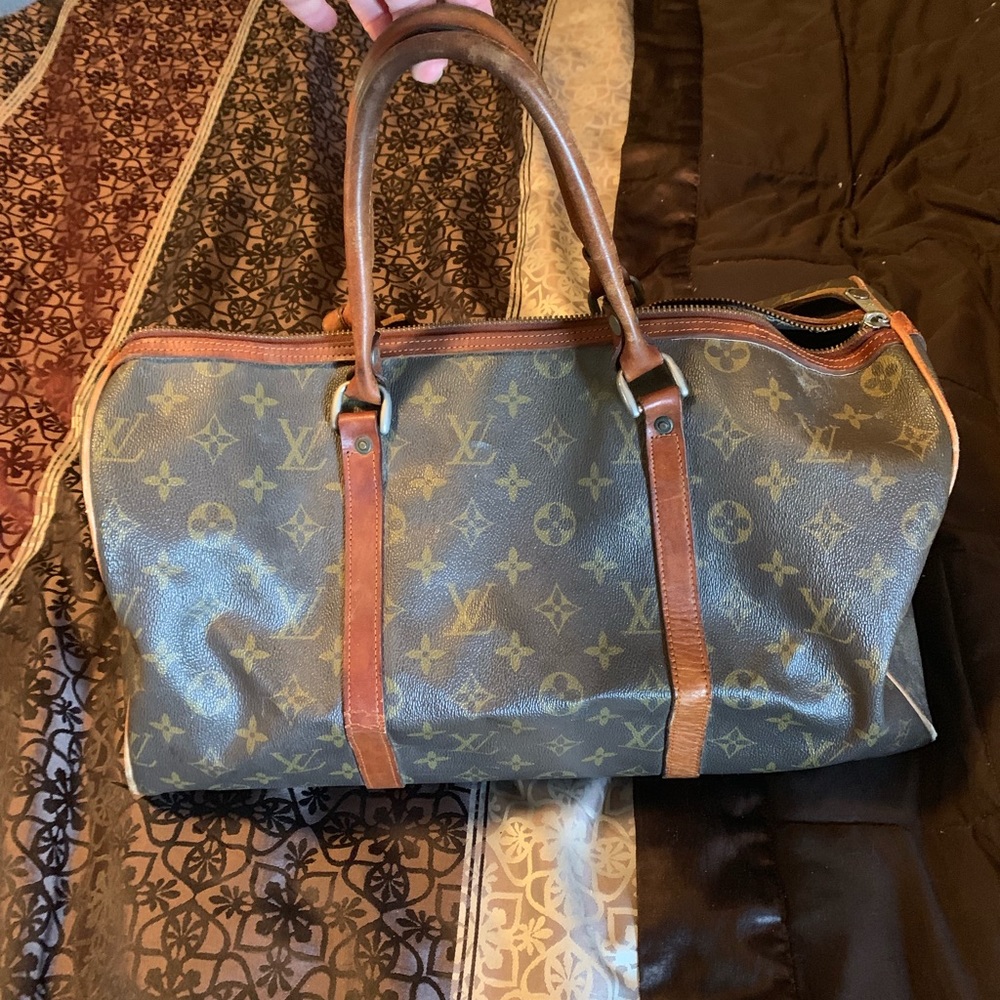 Louis Vuitton overnight bag and makeup bag
